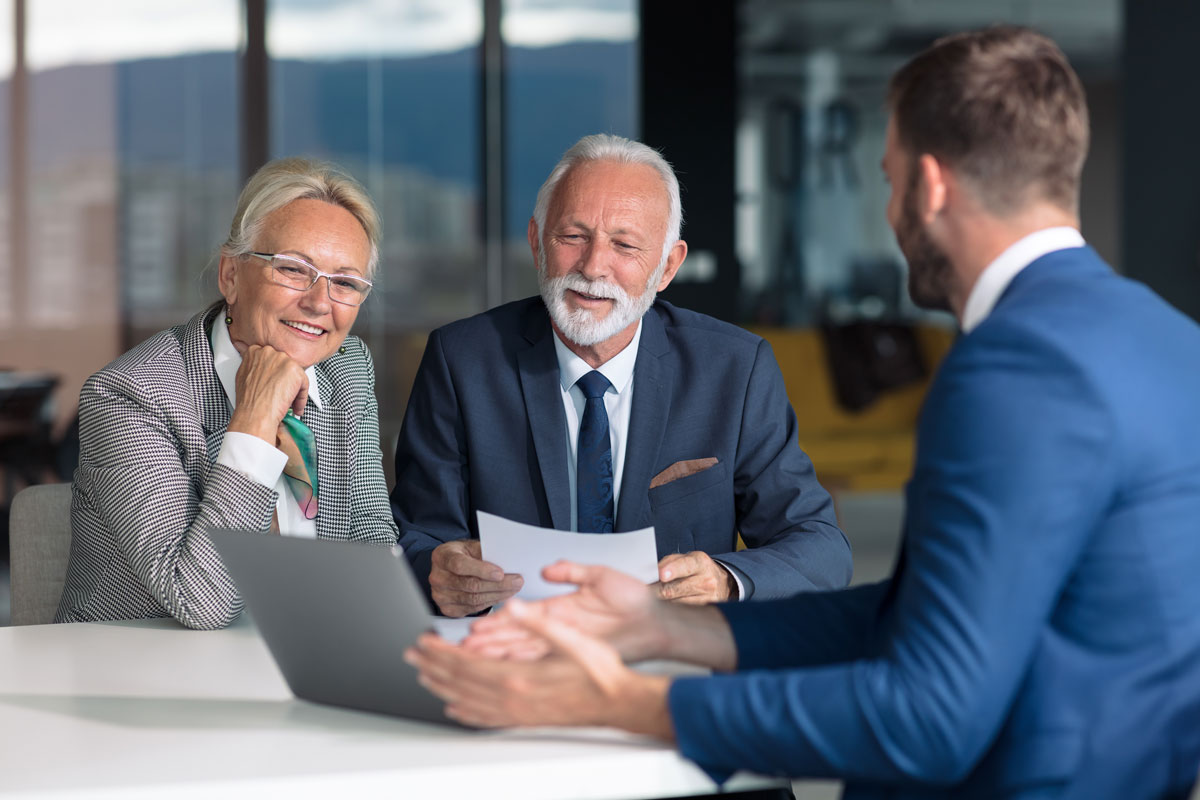 Couple consulting a financial counselor.